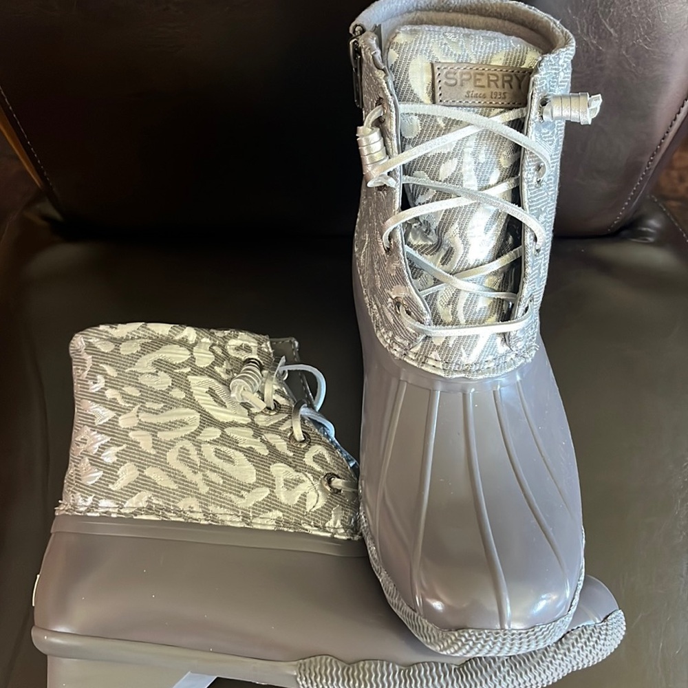 Silver and gray Sperry Rain boots. Brand new. Cover ankles, silver laces